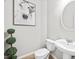 Bathroom with modern fixtures, white pedestal sink and neutral wall color at 2018 Remington Oaks Cir, Cary, NC 27519