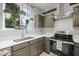This is a bright kitchen boasting stainless steel appliances and stylish cabinetry at 2018 Remington Oaks Cir, Cary, NC 27519