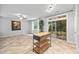 Living space featuring tile flooring, natural light, and sliding glass doors to the patio at 2018 Remington Oaks Cir, Cary, NC 27519
