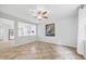 Bright and open living room features neutral walls and tile flooring throughout at 2018 Remington Oaks Cir, Cary, NC 27519