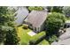 Aerial view showing the home's backyard with a small patio and mature landscaping at 206 Lake Brandt Dr, Cary, NC 27519