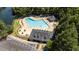 Aerial view of the community clubhouse, pool, parking, and surrounding mature landscaping at 206 Lake Brandt Dr, Cary, NC 27519