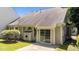 Home exterior featuring a small patio, and sliding glass doors at 206 Lake Brandt Dr, Cary, NC 27519
