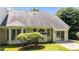 Home exterior featuring a large back yard, sliding glass doors, and mature landscaping at 206 Lake Brandt Dr, Cary, NC 27519