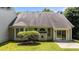 Home exterior featuring a large back yard, many windows, and mature landscaping at 206 Lake Brandt Dr, Cary, NC 27519