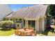 Home exterior showcasing a patio with outdoor furniture and sliding glass doors at 206 Lake Brandt Dr, Cary, NC 27519