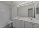 Clean bathroom equipped with a dual sink vanity, toilet, and a shower-tub combination for everyday convenience at 206 Lake Brandt Dr, Cary, NC 27519