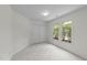 Bright bedroom featuring double windows that let in natural light and closet at 206 Lake Brandt Dr, Cary, NC 27519