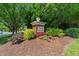 Community signage for Lakeridge/Preston Village surrounded by colorful landscaping and mulch at 206 Lake Brandt Dr, Cary, NC 27519
