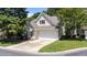 Charming home featuring neutral siding, a two-car garage, and well-maintained landscaping in a suburban neighborhood at 206 Lake Brandt Dr, Cary, NC 27519