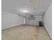 Spacious two-car garage with a automatic door and concrete flooring at 206 Lake Brandt Dr, Cary, NC 27519