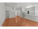 Open-layout living room with kitchen and stainless steel appliances in the background at 206 Lake Brandt Dr, Cary, NC 27519