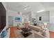 Comfortable living room featuring a fireplace, sofa, and a seating area at 206 Lake Brandt Dr, Cary, NC 27519