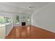 Open-layout living room with fireplace and vaulted ceilings providing lots of light at 206 Lake Brandt Dr, Cary, NC 27519
