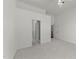 Spacious main bedroom boasts neutral carpet and white walls with a view to the ensuite bathroom and walk-in closet at 206 Lake Brandt Dr, Cary, NC 27519