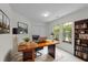 Bright and airy office with modern desk, bookcase, and outside view at 206 Lake Brandt Dr, Cary, NC 27519
