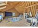 Unfinished attic space offering potential for storage or renovation with exposed wood beams and natural light at 2224 Narrawood St, Raleigh, NC 27614