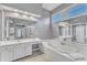 Luxury bathroom features a soaking tub, shower, double vanities, and spacious layout at 2224 Narrawood St, Raleigh, NC 27614
