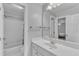 Clean, well-lit bathroom features a vanity with a sink and a combined tub and shower at 2224 Narrawood St, Raleigh, NC 27614