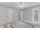 Serene bedroom features neutral walls, ceiling fan, double closets and neutral carpet at 2224 Narrawood St, Raleigh, NC 27614