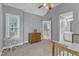 Neutral bedroom with vaulted ceiling features carpet flooring and entry to hall and bathroom at 2224 Narrawood St, Raleigh, NC 27614