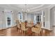 Bright dining room featuring hardwood floors, a chandelier, and a view to living room at 2224 Narrawood St, Raleigh, NC 27614