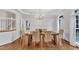 Elegant dining room with hardwood floors, wainscoting, and stylish chandelier at 2224 Narrawood St, Raleigh, NC 27614