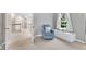 Hallway features a comfortable chair and window seat with a wooded view at 2224 Narrawood St, Raleigh, NC 27614