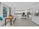 Bright kitchen with white cabinets, stainless steel appliances, subway tile backsplash, and breakfast bar seating at 2224 Narrawood St, Raleigh, NC 27614