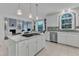 Spacious kitchen island features a cooktop and opens to the living and dining areas at 2224 Narrawood St, Raleigh, NC 27614