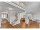 Open-concept living space with hardwood floors, staircase, and view to dining room at 2224 Narrawood St, Raleigh, NC 27614