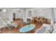 Open-concept living room with hardwood floors, view to dining room, and comfortable seating at 2224 Narrawood St, Raleigh, NC 27614