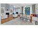 Open concept living area features a fireplace, built-in shelving, and a dining area with large windows at 2224 Narrawood St, Raleigh, NC 27614