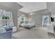 Primary bedroom boasts vaulted ceiling, carpet flooring, and plenty of natural light at 2224 Narrawood St, Raleigh, NC 27614