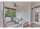Relaxing screened porch with ample seating and a ceiling fan, perfect for enjoying the outdoors at 2224 Narrawood St, Raleigh, NC 27614