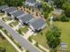 Aerial view showcases modern homes with landscaped yards in a well-planned community at 2225 Millbank Village Ct # 101, Raleigh, NC 27610