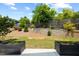 Landscaped backyard featuring a tiered garden, offering a serene outdoor space at 2225 Millbank Village Ct # 101, Raleigh, NC 27610