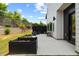 Landscaped backyard with wooden planters and a patio area, perfect for outdoor living at 2225 Millbank Village Ct # 101, Raleigh, NC 27610