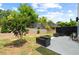 Spacious backyard with mature trees, planters and patio area, ideal for outdoor living at 2225 Millbank Village Ct # 101, Raleigh, NC 27610