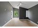 Spacious bedroom featuring a ceiling fan, grey walls, and light hardwood flooring at 2225 Millbank Village Ct # 101, Raleigh, NC 27610