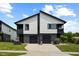 Modern duplex with stylish garages, clean lines, and well-maintained landscaping at 2225 Millbank Village Ct # 101, Raleigh, NC 27610