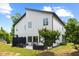 Contemporary home featuring a well-manicured yard, patio and modern architectural details at 2225 Millbank Village Ct # 101, Raleigh, NC 27610