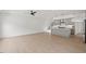 Open-concept living room featuring hardwood floors, modern fixtures, and plenty of natural light at 2225 Millbank Village Ct # 101, Raleigh, NC 27610