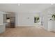 Spacious living room with stainless steel appliances and ample natural light at 2225 Millbank Village Ct # 101, Raleigh, NC 27610