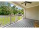 Spacious covered back porch and backyard view with a playset at 225 East End Ave, Durham, NC 27703
