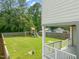 Backyard view with a playset and wooden fence at 225 East End Ave, Durham, NC 27703