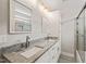 Bathroom featuring dual sinks, granite countertop, white cabinets, and a large mirror at 225 East End Ave, Durham, NC 27703