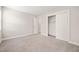 Neutral bedroom featuring carpeted floors, large closet, and a ceiling light fixture at 225 East End Ave, Durham, NC 27703