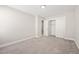 Neutral bedroom featuring carpeted floors, large closet, and a ceiling light fixture at 225 East End Ave, Durham, NC 27703