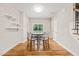 A view of the dining area showcasing natural light, hardwood flooring, and modern finishes at 225 East End Ave, Durham, NC 27703
